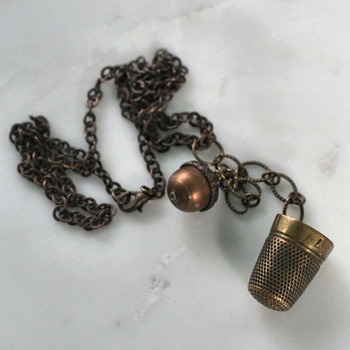 Peter Pan and Wendy Thimble and Acorn Kisses in Aged Brass