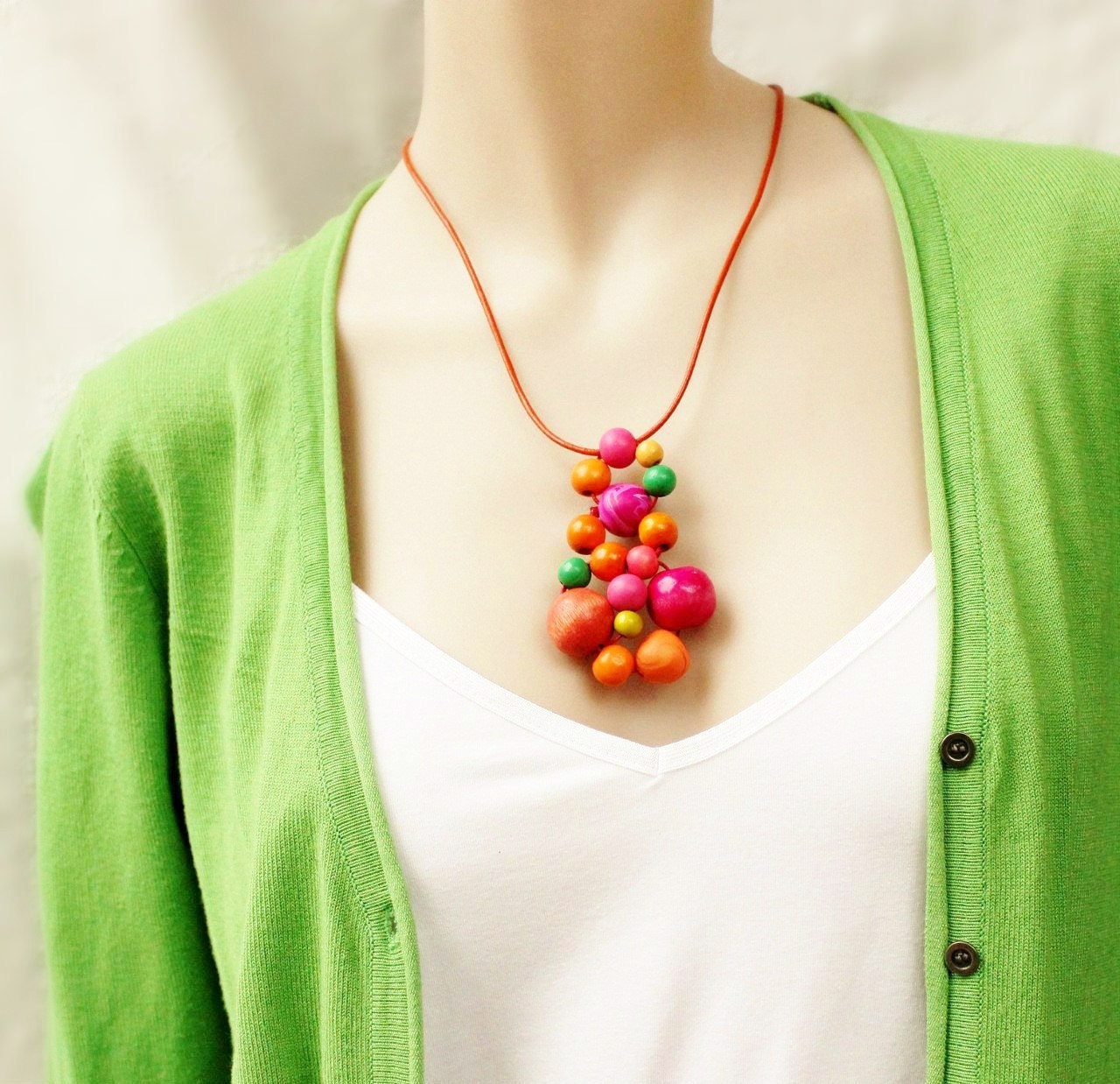 Wooden bead pendant, orange, pink, emerald green, woven beads, seventies inspired, funky, contemporary beads