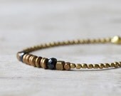 Brass beaded bracelet: brass discs and black spinel beaded bracelet. Brass & beads collection.