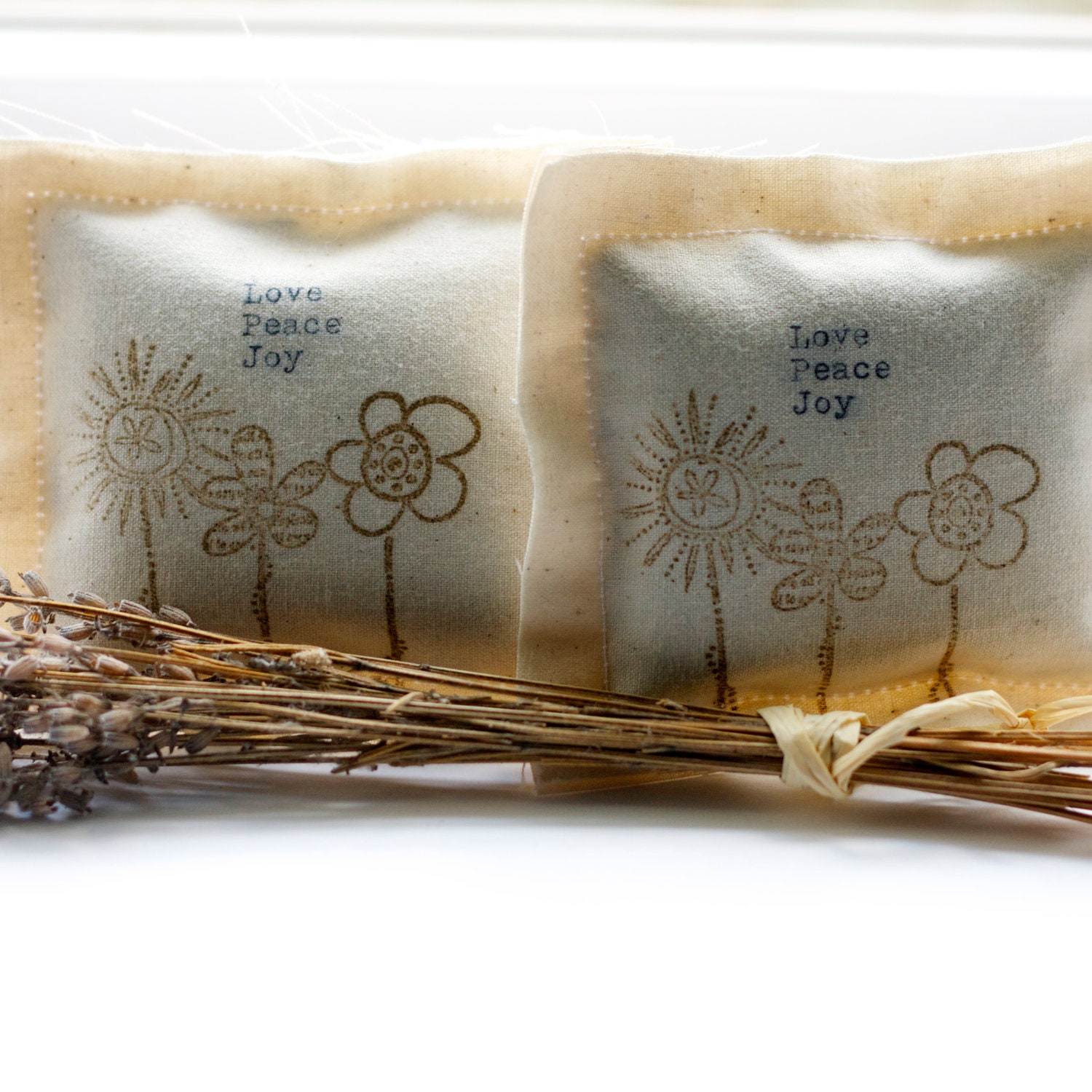 handmade lavender pillows. Brown hand stamped flowers on cotton fabric hand typed words. hostess gift, dresser decor, bedroom fresh