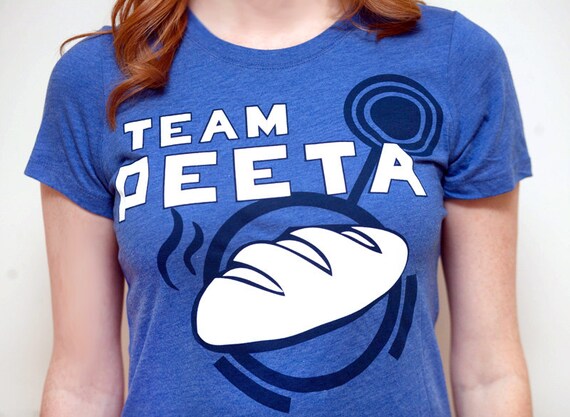 Women's Hunger Games Team Peeta T-Shirt with Bread Graphic, Blue, SIZE MEDIUM