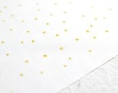xox in mustard yellow on pure white handprinted fabric panel