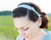 Hair accessory, ribbon with a little bow, made of pure light blue silk.