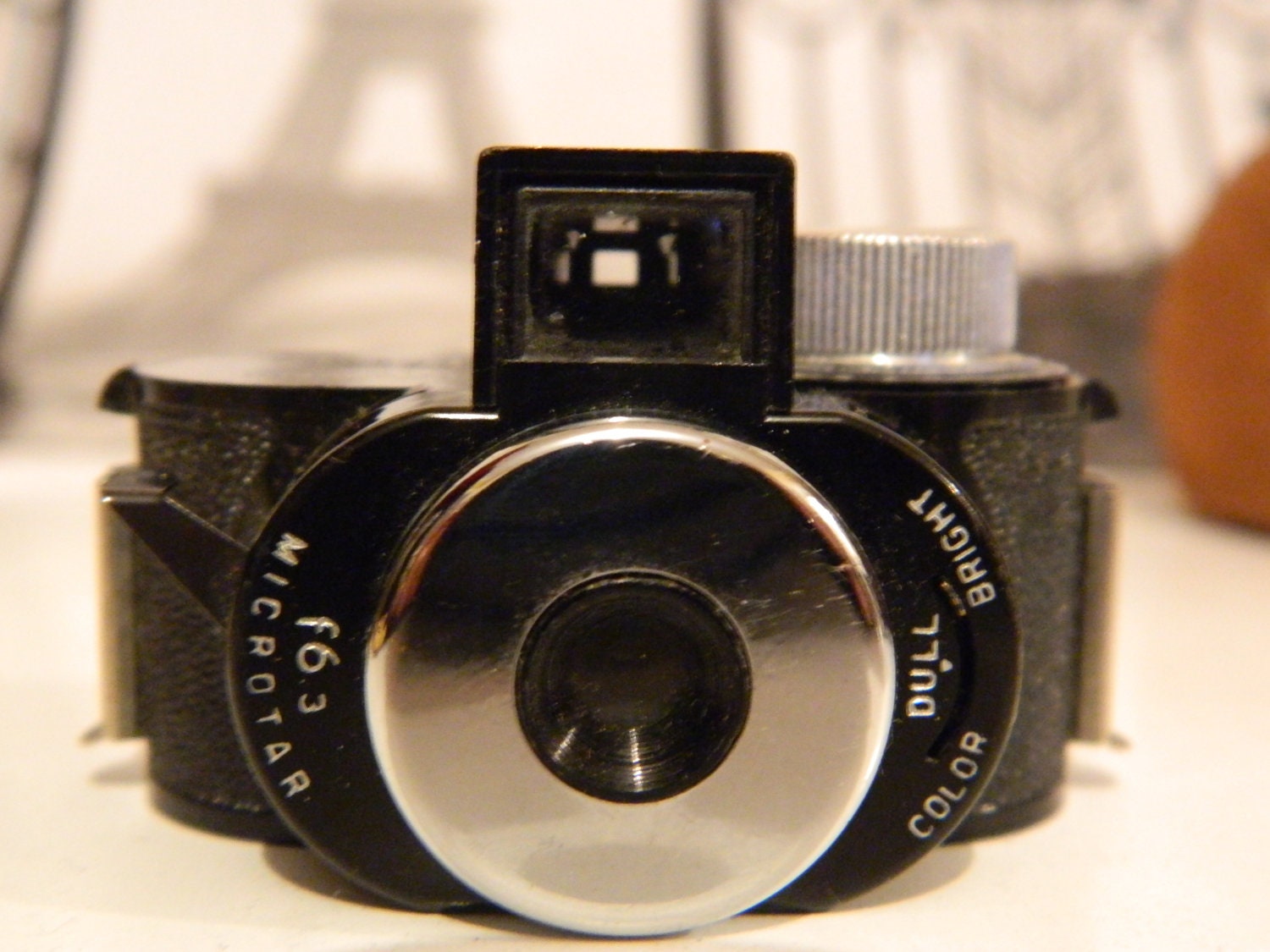 Miniture "Pixie" Camera with Pixie instruction book and handy dandy swede carry case.