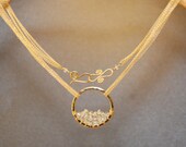 Necklace 271 Hammered circle wrapped with aquamarine