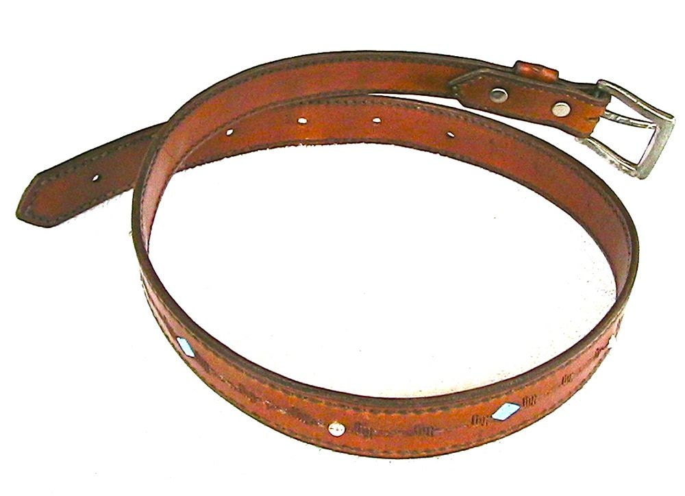 Leather belt with turquoise and silver bead inlay and barbed wire motif.