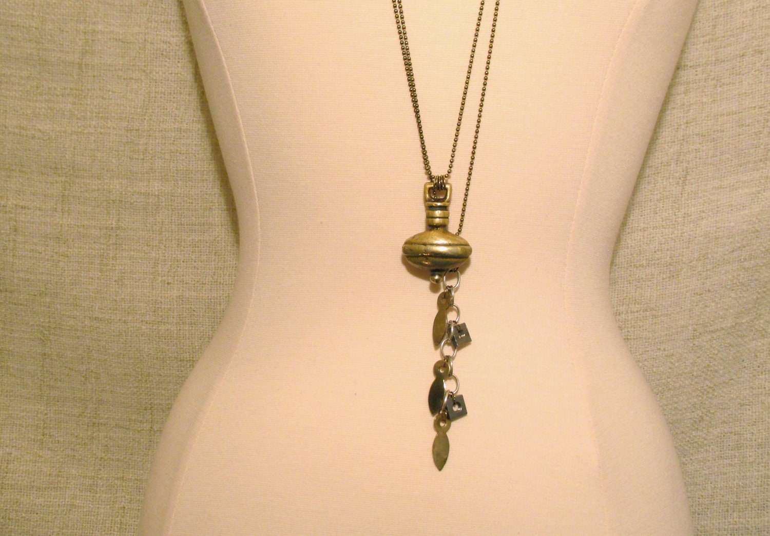 Antique Brass 40" long charm necklace "Ananta"