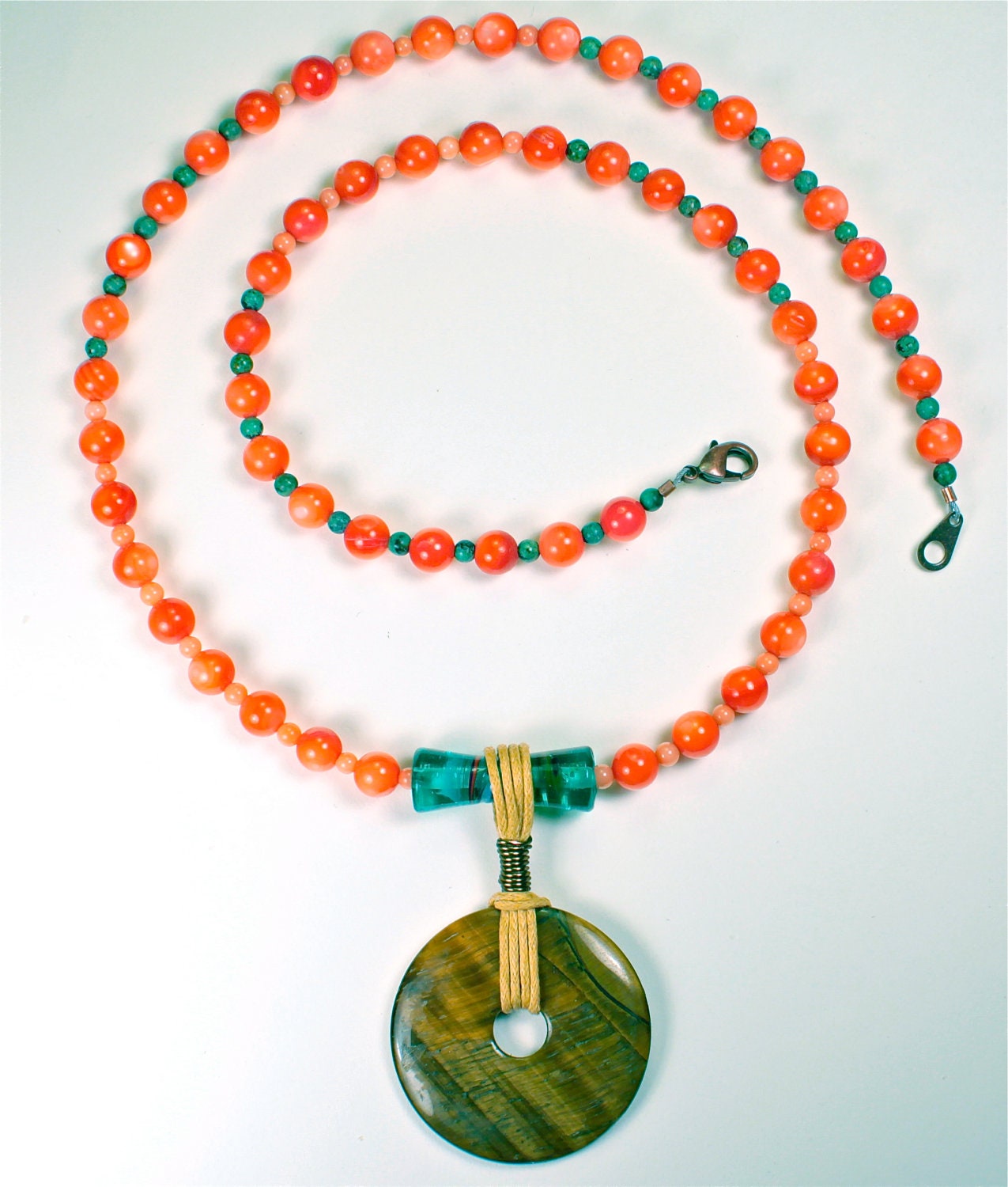 Coral and turquoise beaded necklace with cord-wrapped agate.