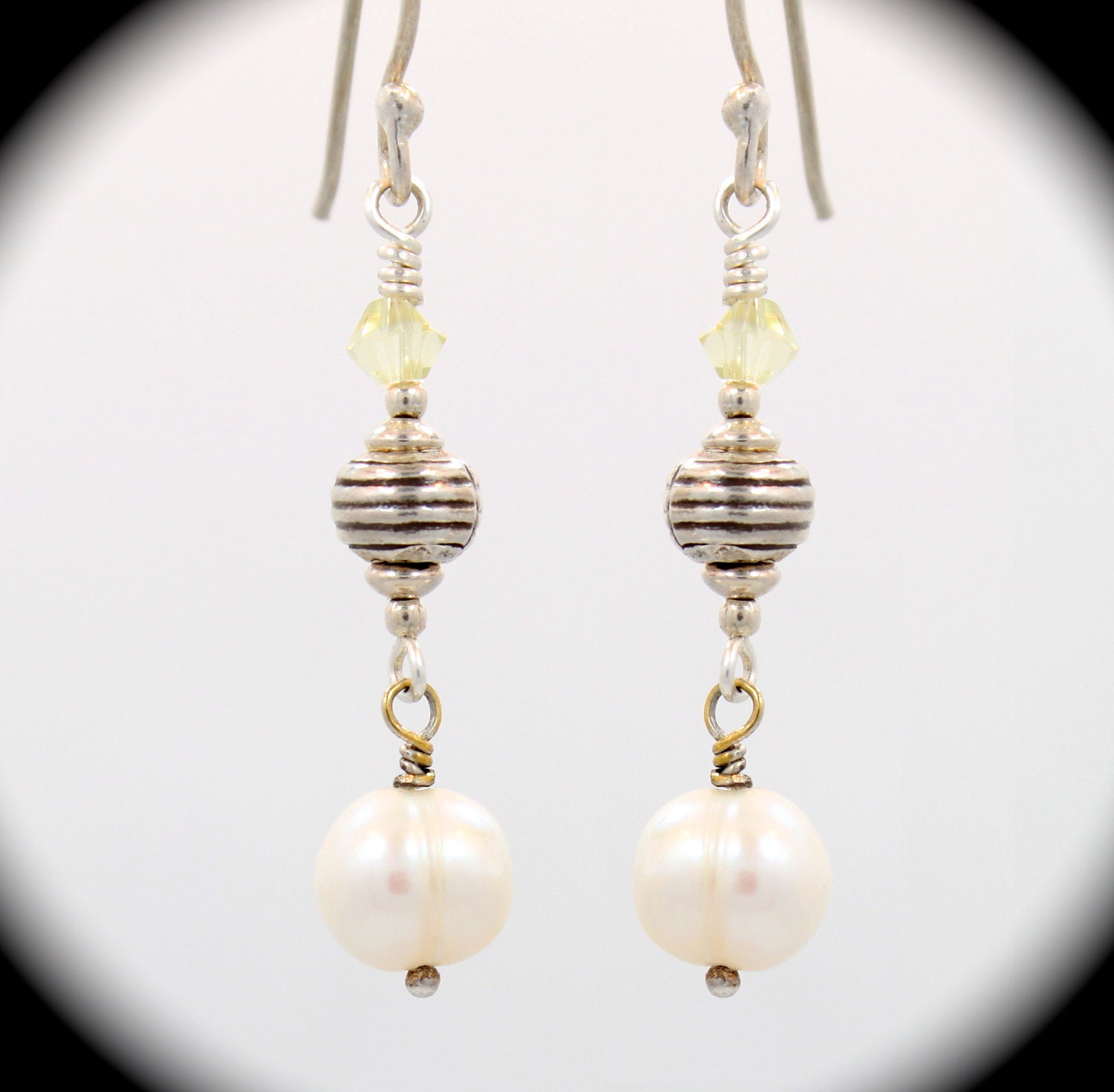 Beautiful and interesting sterling silver Bali bead with lovely creamy white freshwater pearl on sterling ear wires.