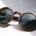 Tortoise Sunglasses With Dark Green Glasses