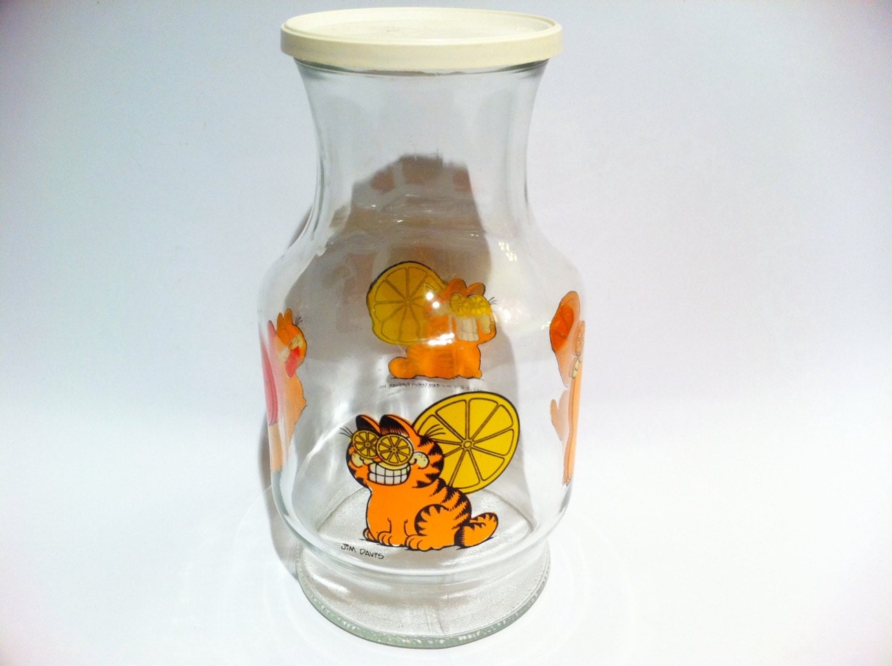 Vintage Garfield glass carafe juice pitcher with lid.