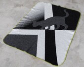 Knitted merino wool blanket for children.  Art deco inspired cat motif.