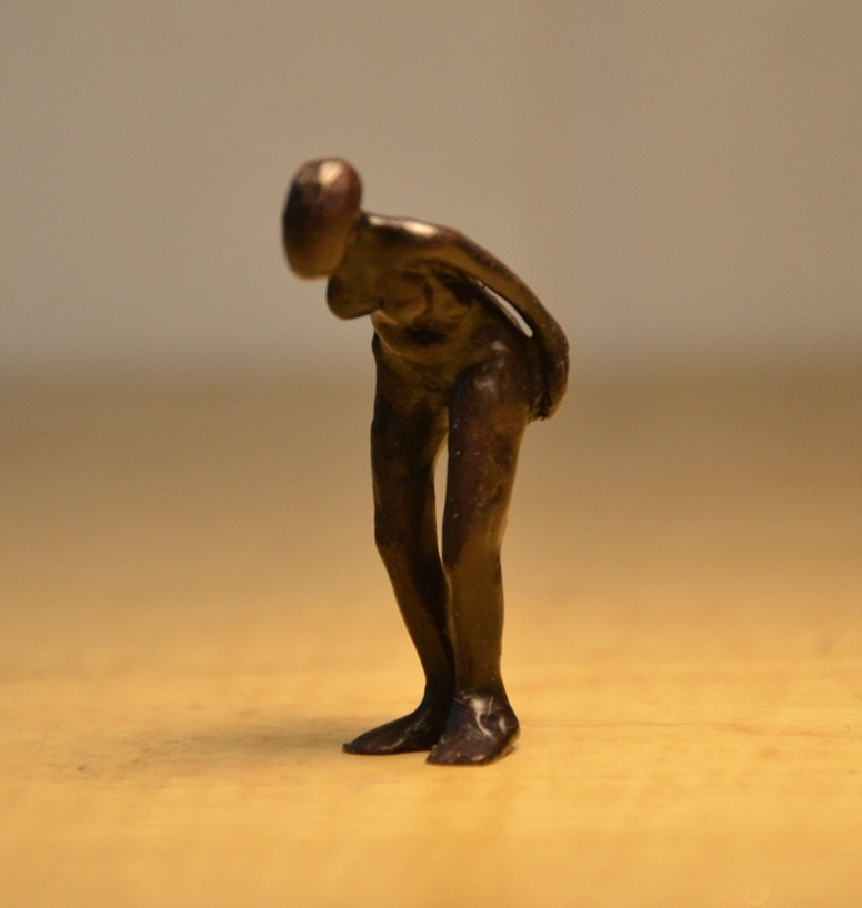 Bending female figure