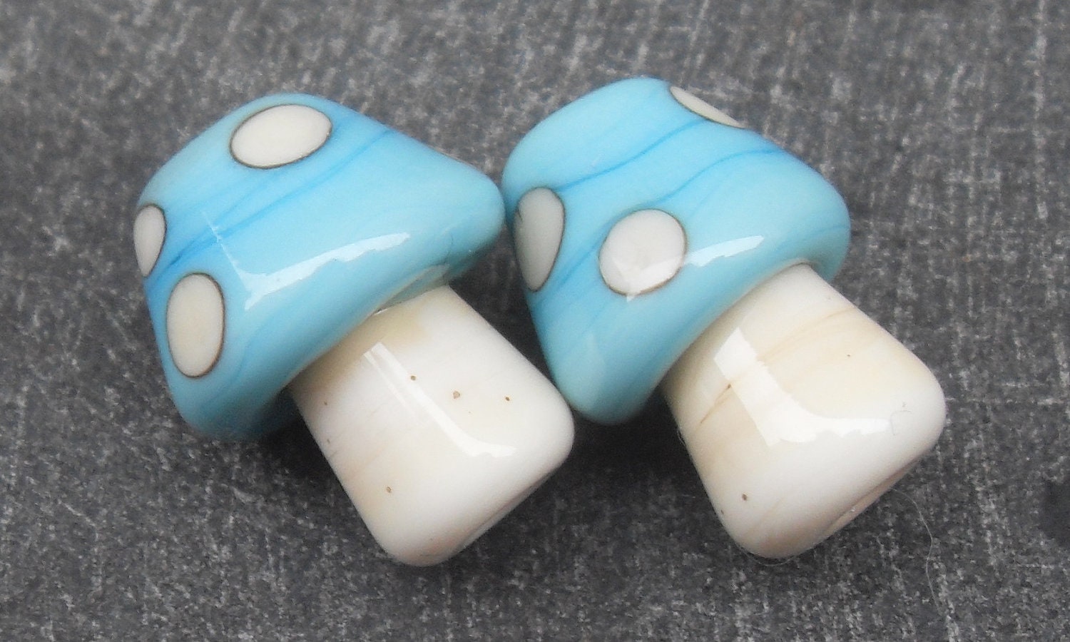 Pair of turquoise toadstools / mushrooms