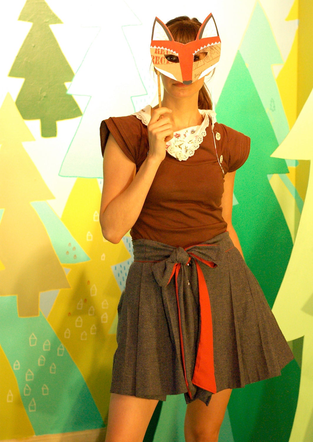 herringbone gets a bow --wrap skirt, front pleating, side pockets, red cotton liner, snap closure. bow skirt.