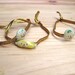 Golden Bracelet with elastic trim. Fruits. Porcelain charms. Pineapple, Strawberry and Banana.