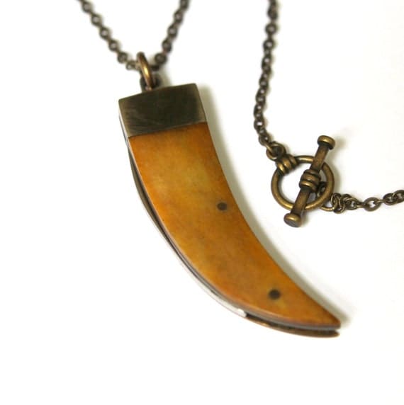 Genuine Amber Bone Claw Pendant Necklace with a Hidden Folding Knife Blade