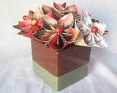 Thanksgiving paper flower arrangement in ceramic vase, brown and green