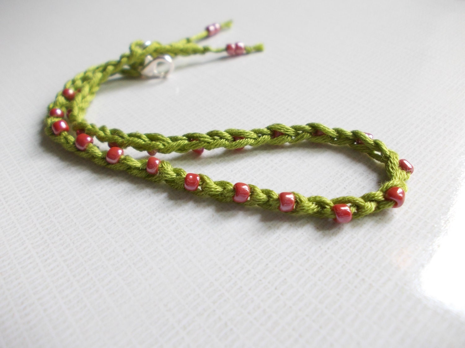Plus size. Bracelet. Crochet. Red tiny seed beads and green cotton.