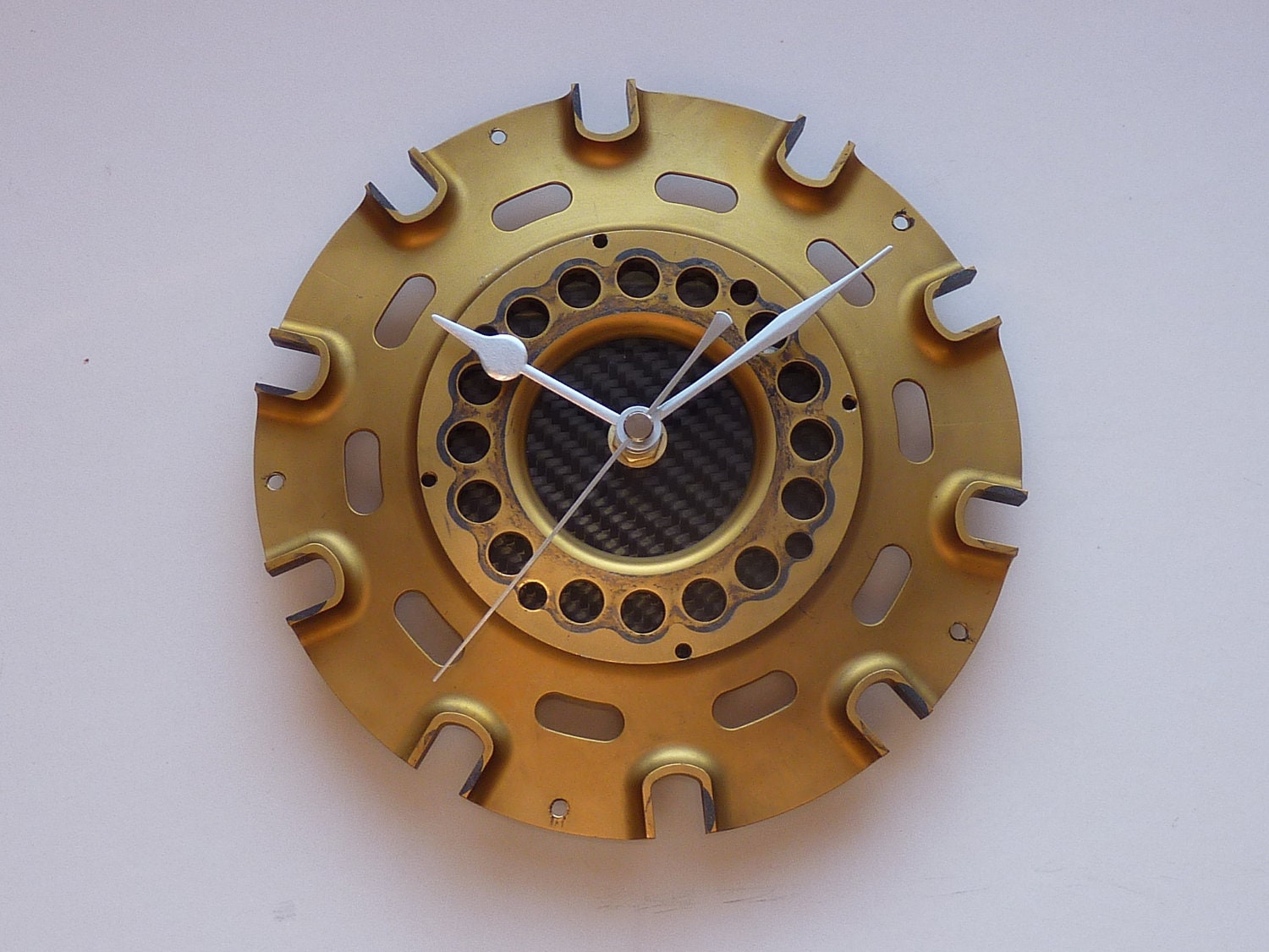 Unique gold & black wall clock made from carbon fiber and a titanium F1 racecar part
