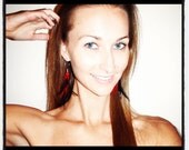 Red and black feather earrings with red sea glass bead on small gold plated hoop