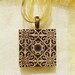 Tan and Black Flower Pattern Wood Tile Pendant Necklace