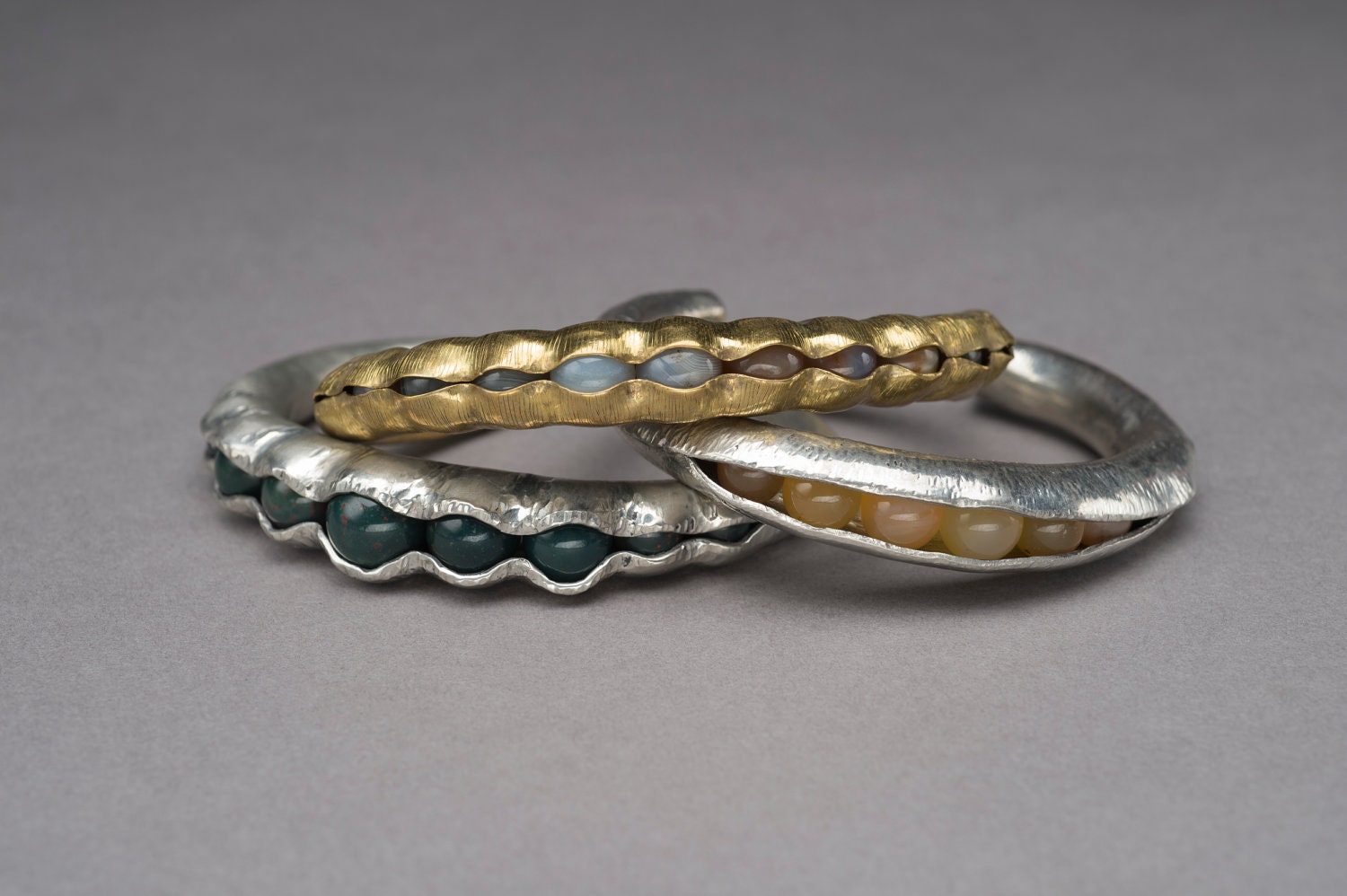 Brass and carnelian anticlastic hammer formed pod cuff bracelet