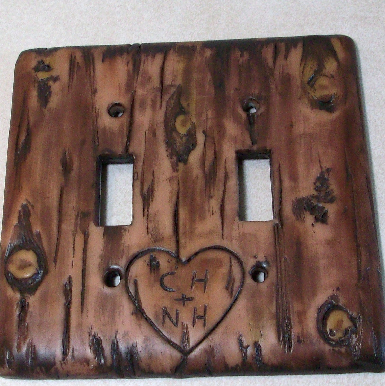 Carved love initials in a Bark of a tree light switch cover