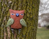 Red Owl with Green Wings
