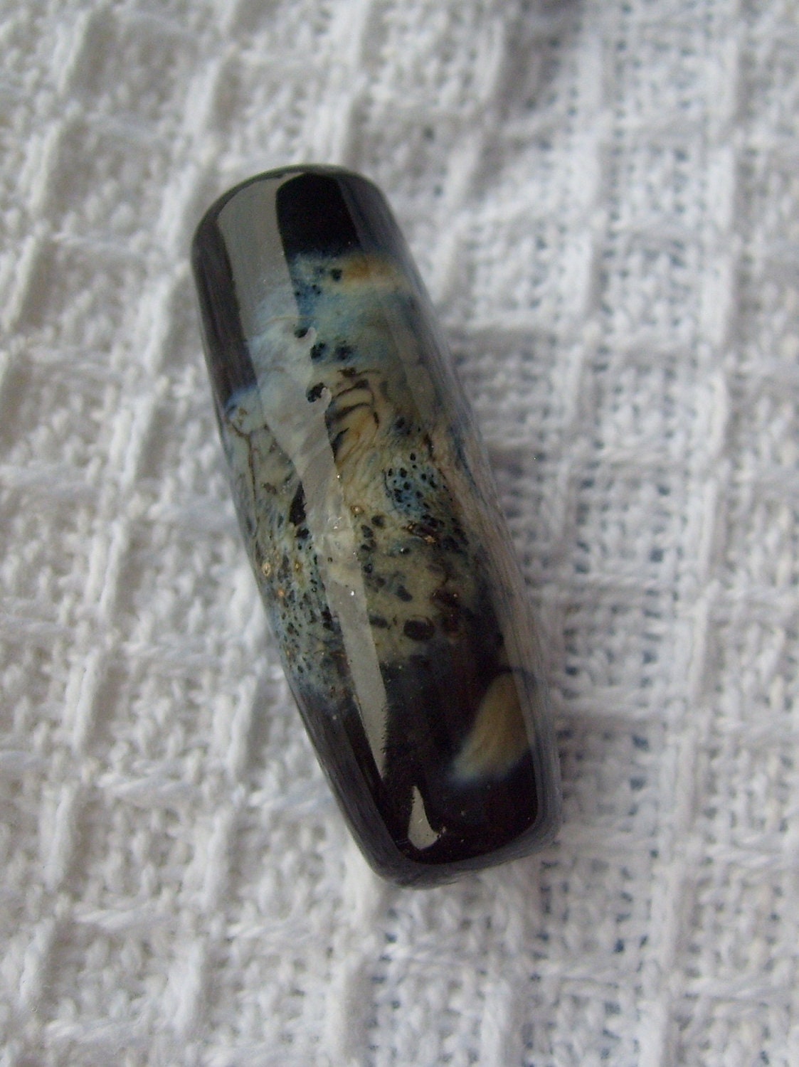 SALE    Handmade Focal Bead,  Black and Silvered Ivory Shard Wrapped