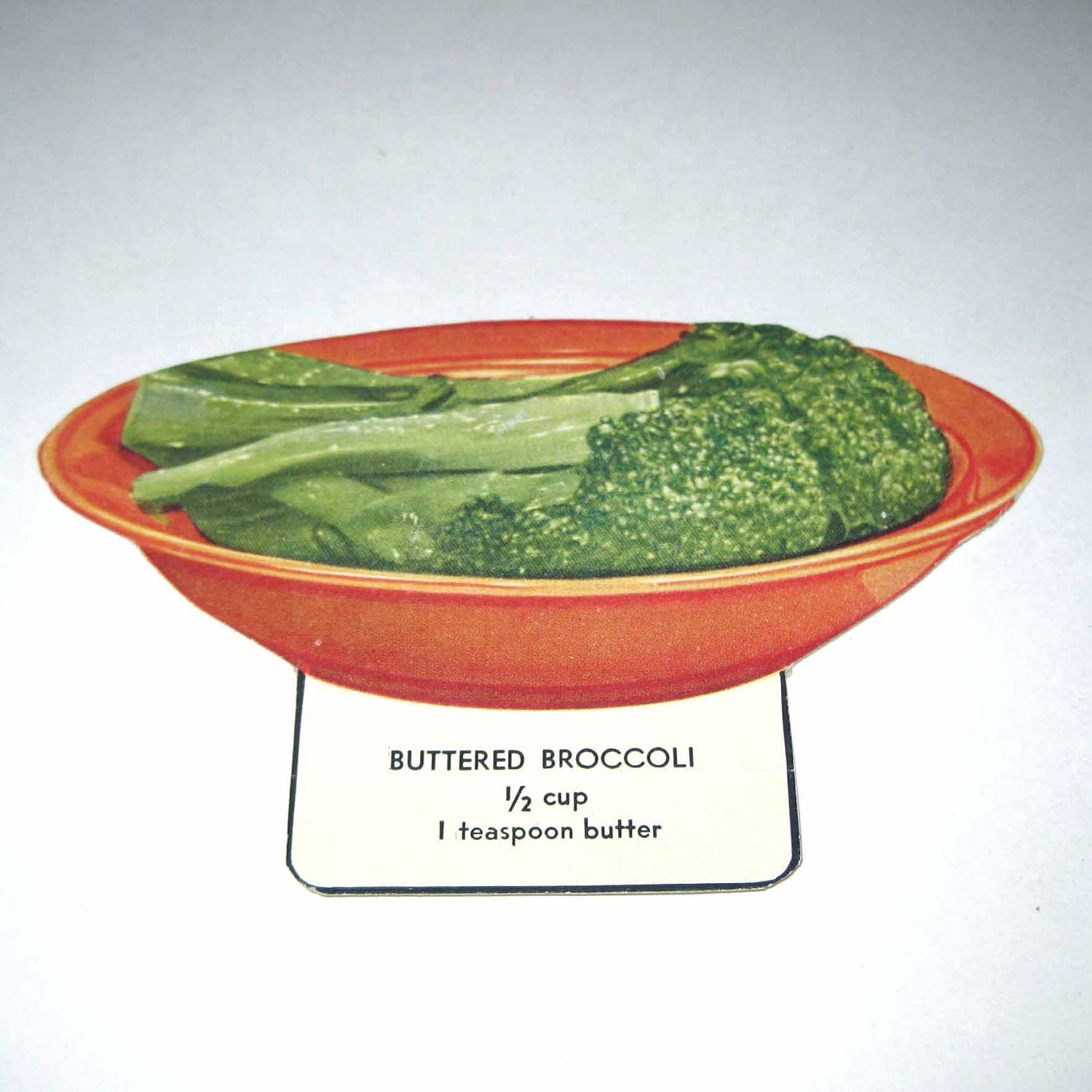 Vintage Food or Nutrition Die Cut Cardboard School Decoration of Buttered Broccoli