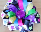 Unique handmade Star print hair bow clip with sparkly purple acrylic cirlcle