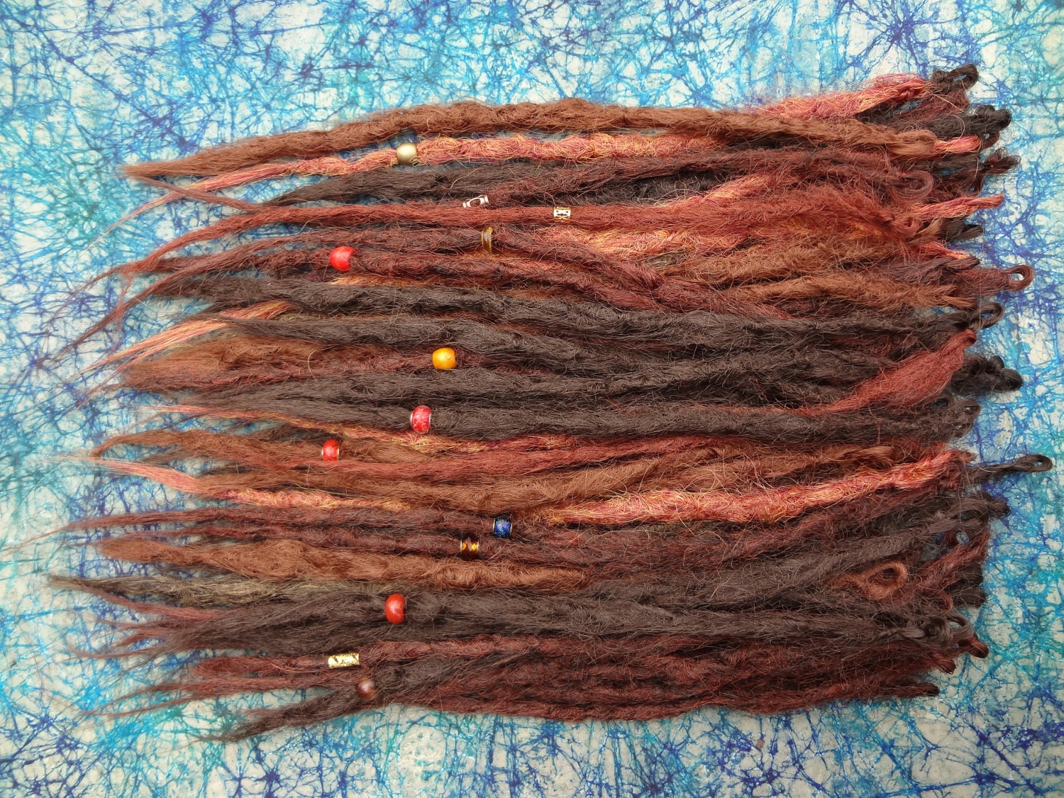 Full kit of 60 Single ended knotty dreadlock extensions. Braid in natural style Synthetic dreads in auburn, brown, and cayenne