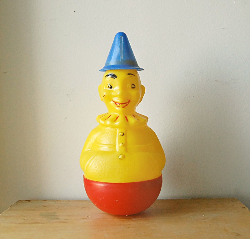 Vintage Rare Yellow Red and Blue Plastic Roly Poly 1940s Circus Clown Toy Piggy Bank.