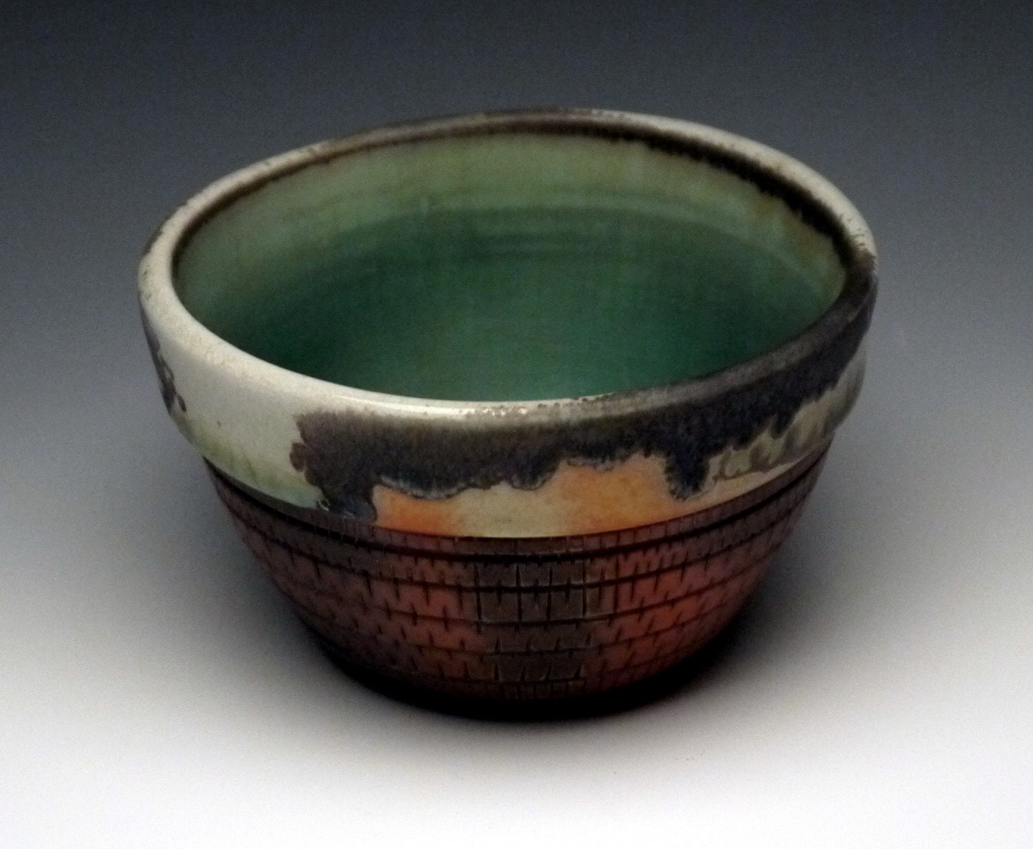 Bowl, porcelain, oribe glaze, avery flashing, woodfired