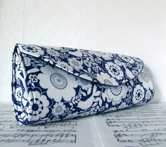 navy blue and white clutch bag