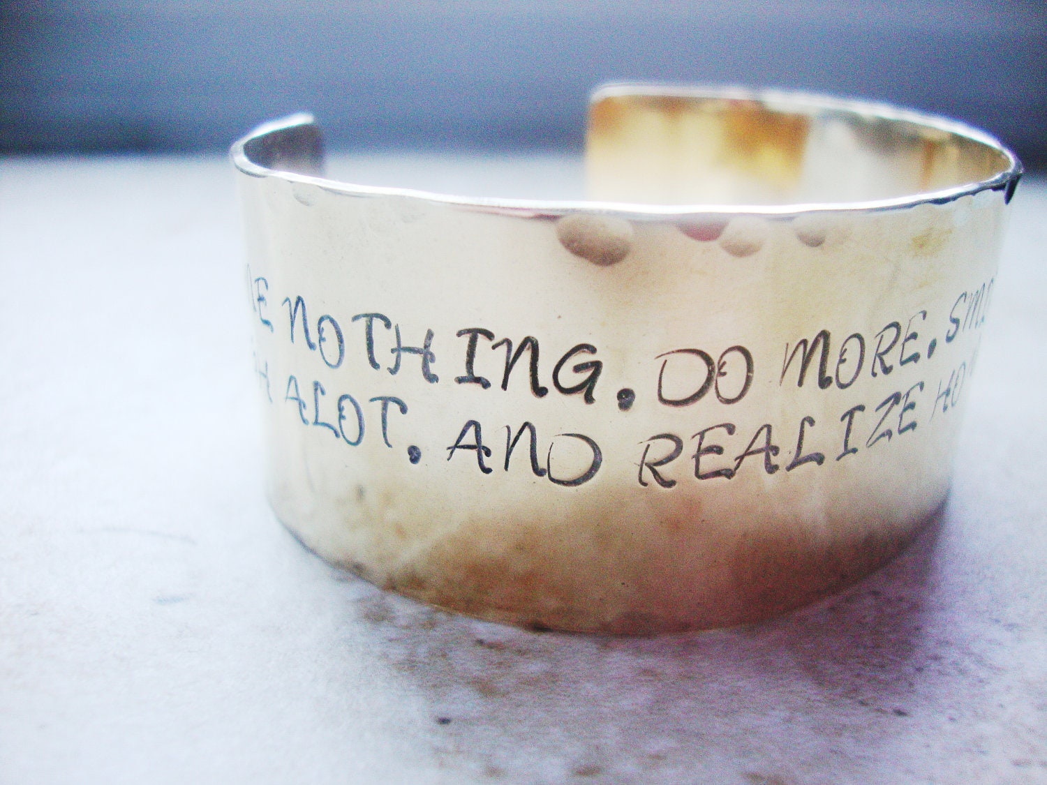 Wide brass statement cuff hand stamped with inspirational words