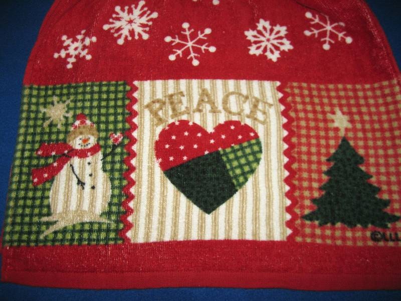 Hanging crocheted top kitchen towel with snowflakes and snowman