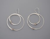 Handmade jewelry. Sterling silver circle earrings with shiny rivets