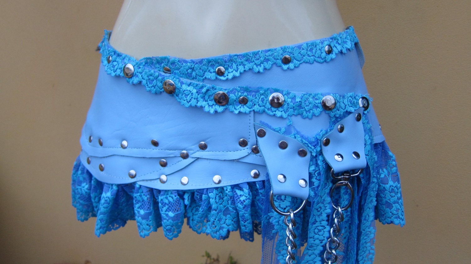 vintage inspired bohemian ice blue leather mini skirt belt/tutu with stud detail and chain....