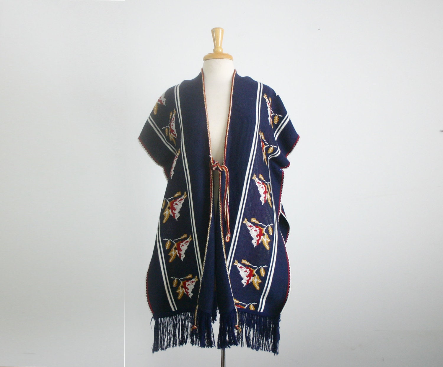 1970s Vintage knit cape/ poncho in navy blue with a bird motif