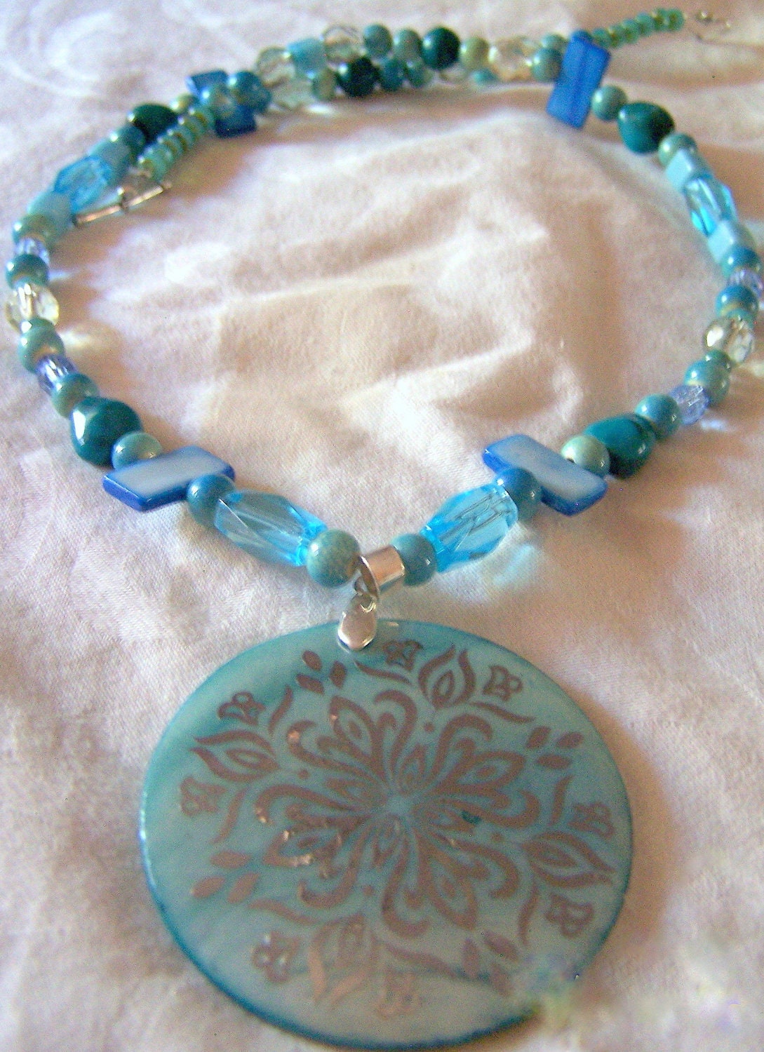 Handmade Necklace, blue shell pendant, blue glass beads, mother of pearl, turquoise, sea glass colors, mermaid, handcrafted, shades of sea