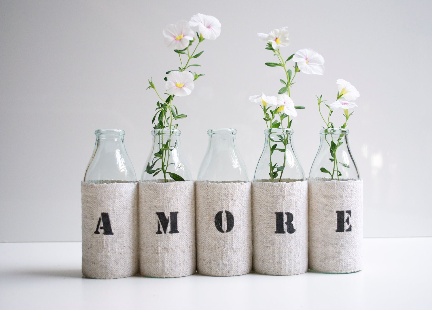AMORE vase -  from 5 small recycled glass bottles and a grain sack cover
