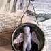 RESERVED Baby Magic winged porcelain doll glass fronted tin hanging diorama RESERVED