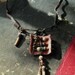 Leather and bead amulet necklace - tribal glass beads, gold coral and raw sapphire