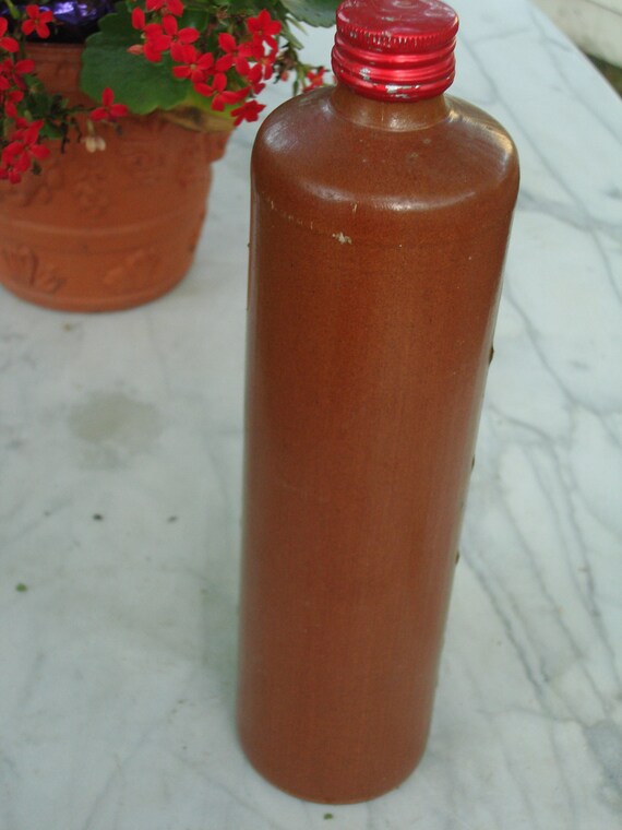 Items similar to SALE NOW antique liquor pottery bottle metal srew on top salt glazed pottery