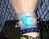 RESERVED Leather wrap bracelet with reversible copper enamel face
