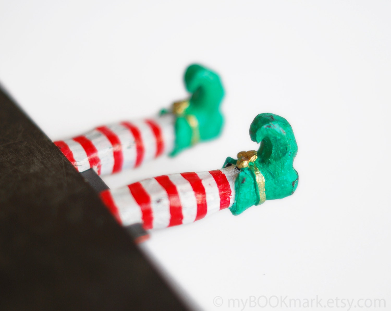Elf in the book. Green shoes. Unusual art bookmark. Fun for kids  oht Christmas