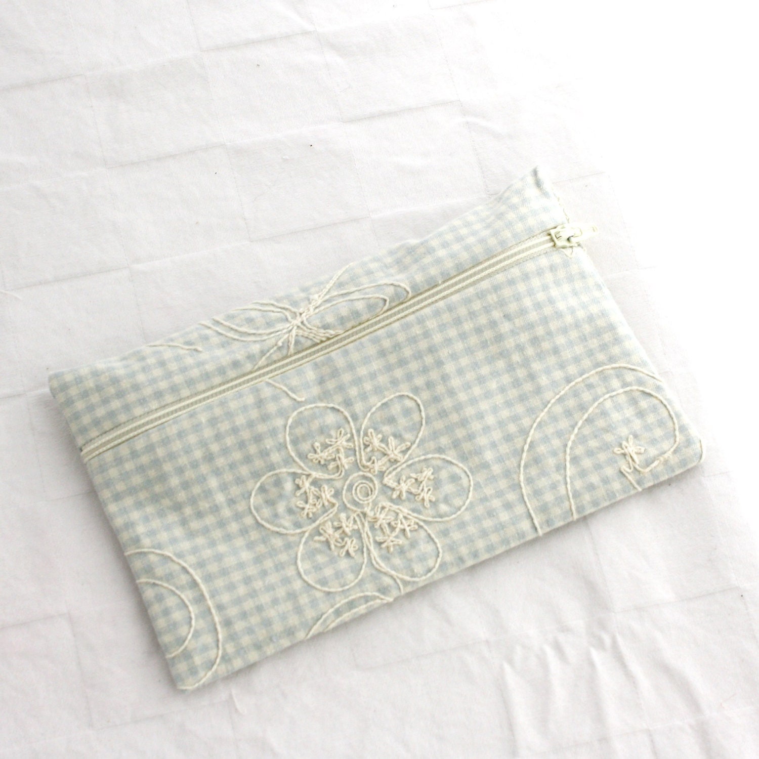 Embroidered clutch- passport holder, change purse or cosmetic bag. Zippered pouch for travel bag or makeup.