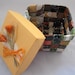 Colorful handwoven paper basket with lid crafted from upcycled paper